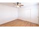 Spacious bedroom with ceiling fan, sliding closet doors, and ample natural light at 3212 N 49Th Ln, Phoenix, AZ 85031