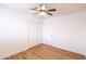 Bright bedroom featuring a ceiling fan and a spacious closet for ample storage at 3212 N 49Th Ln, Phoenix, AZ 85031