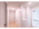 Bright hallway with built in nooks offers seamless flow and access to various rooms at 3212 N 49Th Ln, Phoenix, AZ 85031