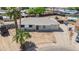 Bird's eye view of the home features a well-kept lawn, driveway, and desert landscaping at 3212 N 49Th Ln, Phoenix, AZ 85031