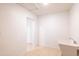 Bright laundry room with a utility sink and easy access to other areas of the home at 3212 N 49Th Ln, Phoenix, AZ 85031