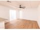 Bright and spacious living room featuring modern floors and a sleek ceiling fan at 3212 N 49Th Ln, Phoenix, AZ 85031