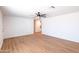 Bright, airy living room features wood-look floors, neutral walls, and a ceiling fan at 3212 N 49Th Ln, Phoenix, AZ 85031