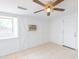 Versatile room with natural light, a ceiling fan, and a door to outdoor living at 3212 N 49Th Ln, Phoenix, AZ 85031