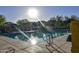 Sparkling pool with lounge chairs, landscaping, and mountain views on a bright sunny day at 34940 N 30Th Ave, Phoenix, AZ 85086