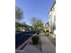 A well-maintained street with sidewalks, trees, and appealing two-story homes in a residential community at 34940 N 30Th Ave, Phoenix, AZ 85086