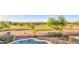Lush backyard with mature trees, pool and amazing golf course views at 43324 W Desert Fairways Dr, Maricopa, AZ 85138