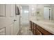 View of a bathroom featuring a dual-sink vanity and walk-in shower at 43324 W Desert Fairways Dr, Maricopa, AZ 85138