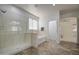 Bathroom showcasing a glass enclosed shower and separate soaking tub at 43324 W Desert Fairways Dr, Maricopa, AZ 85138