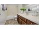 Well-lit bathroom featuring a single sink vanity, and walk-in shower at 43324 W Desert Fairways Dr, Maricopa, AZ 85138