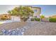 Two-story home featuring rock landscaping with shrubbery at 43324 W Desert Fairways Dr, Maricopa, AZ 85138