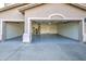 View of this home's attached three car garage with epoxy floors at 43324 W Desert Fairways Dr, Maricopa, AZ 85138
