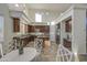 Bright kitchen with tall ceilings, stainless steel appliances and a center island with seating at 43324 W Desert Fairways Dr, Maricopa, AZ 85138