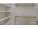 Spacious walk-in closet featuring custom shelving and ample storage space at 43324 W Desert Fairways Dr, Maricopa, AZ 85138