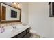 Updated powder bathroom with decorative mirror and vanity at 514 E Vaughn Ave, Gilbert, AZ 85234