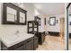 Remodeled primary bathroom with dual vanities and a soaking tub at 514 E Vaughn Ave, Gilbert, AZ 85234