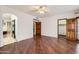 Primary bedroom with wood floors, ensuite bathroom, and a private door to patio at 514 E Vaughn Ave, Gilbert, AZ 85234