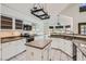 Bright kitchen with white cabinets, granite countertops, island and stainless appliances at 514 E Vaughn Ave, Gilbert, AZ 85234