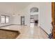 Spacious living room with high ceilings, tile floors and large windows provides ample natural light at 514 E Vaughn Ave, Gilbert, AZ 85234