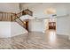 Open floor plan with staircase, beautiful wood-look tile floors and natural light at 514 E Vaughn Ave, Gilbert, AZ 85234