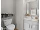 The bathroom has a toilet and sink with a large mirror and nice decorations at 7145 E Cuernavaco Way, Gold Canyon, AZ 85118