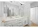 This bathroom offers double sinks, ample counter space, and a large well lit mirror at 7145 E Cuernavaco Way, Gold Canyon, AZ 85118