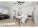 This bedroom boasts a ceiling fan, white furniture and great views to the outside at 7145 E Cuernavaco Way, Gold Canyon, AZ 85118