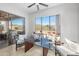 Cozy breakfast nook with glass table, comfortable seating, and scenic backyard view at 7145 E Cuernavaco Way, Gold Canyon, AZ 85118