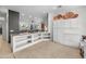 Bright kitchen with open shelving and white cabinets with granite countertops, offering ample storage at 7145 E Cuernavaco Way, Gold Canyon, AZ 85118