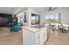 Open-concept kitchen flowing into a living space with a stainless steel dishwasher and sink at 7145 E Cuernavaco Way, Gold Canyon, AZ 85118