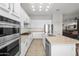 Spacious kitchen with stainless steel appliances, double ovens, and a center island with seating at 7145 E Cuernavaco Way, Gold Canyon, AZ 85118