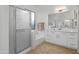 This main bathroom offers a glass shower, a soaking tub, and clean white cabinets at 7145 E Cuernavaco Way, Gold Canyon, AZ 85118