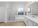 The main bathroom boasts a soaking tub, a glass shower, and white cabinets at 7145 E Cuernavaco Way, Gold Canyon, AZ 85118