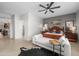 This main bedroom boasts a sitting area, ceiling fan, and calming gray accent wall at 7145 E Cuernavaco Way, Gold Canyon, AZ 85118