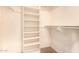 Walk-in closet with built-in shelving and a clothing rod for ample storage and organization at 10903 E Ocaso Ave, Mesa, AZ 85212
