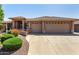 Attractive single-story home featuring a three-car garage and desert landscaping at 10903 E Ocaso Ave, Mesa, AZ 85212