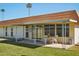 Charming home featuring a covered patio and manicured backyard, perfect for outdoor enjoyment and relaxation at 11113 W Cameo Dr, Sun City, AZ 85351
