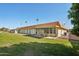 Beautiful home featuring a well-maintained lawn, covered patio area, and charming curb appeal at 11113 W Cameo Dr, Sun City, AZ 85351