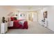 Spacious bedroom with plush carpet, ceiling fan, and ample natural light creating a cozy and inviting atmosphere at 11113 W Cameo Dr, Sun City, AZ 85351
