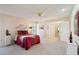 Comfortable bedroom with plush carpet, ceiling fan, and tasteful decor providing a relaxing retreat at 11113 W Cameo Dr, Sun City, AZ 85351