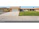 Charming home with a well-manicured lawn, a two-car garage, and a welcoming front exterior at 11113 W Cameo Dr, Sun City, AZ 85351