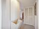 Hallway showcasing built-in storage solutions and neutral colored carpet at 11113 W Cameo Dr, Sun City, AZ 85351
