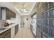 Spacious kitchen boasts white appliances, lots of cabinet storage, skylights and tile flooring at 11113 W Cameo Dr, Sun City, AZ 85351
