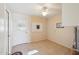 Laundry room with an exterior door and tile flooring at 11113 W Cameo Dr, Sun City, AZ 85351