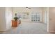 Office space with natural light from the window, wood desk, and neutral carpet at 11113 W Cameo Dr, Sun City, AZ 85351