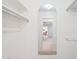 Spacious walk-in closet with mirror providing convenient storage and organization solutions at 11113 W Cameo Dr, Sun City, AZ 85351