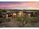 Aerial view of the house with beautiful desert landscaping and tile roof at 11240 E Apache Vistas Dr, Scottsdale, AZ 85262