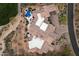 Aerial view of a home with a large backyard, sparkling pool, and tile roof at 11240 E Apache Vistas Dr, Scottsdale, AZ 85262
