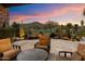 Outdoor patio with comfortable seating and lovely sunset views of the golf course at 11240 E Apache Vistas Dr, Scottsdale, AZ 85262