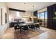 Bright dining room featuring modern lighting, elegant decor and a large window with a view at 11240 E Apache Vistas Dr, Scottsdale, AZ 85262